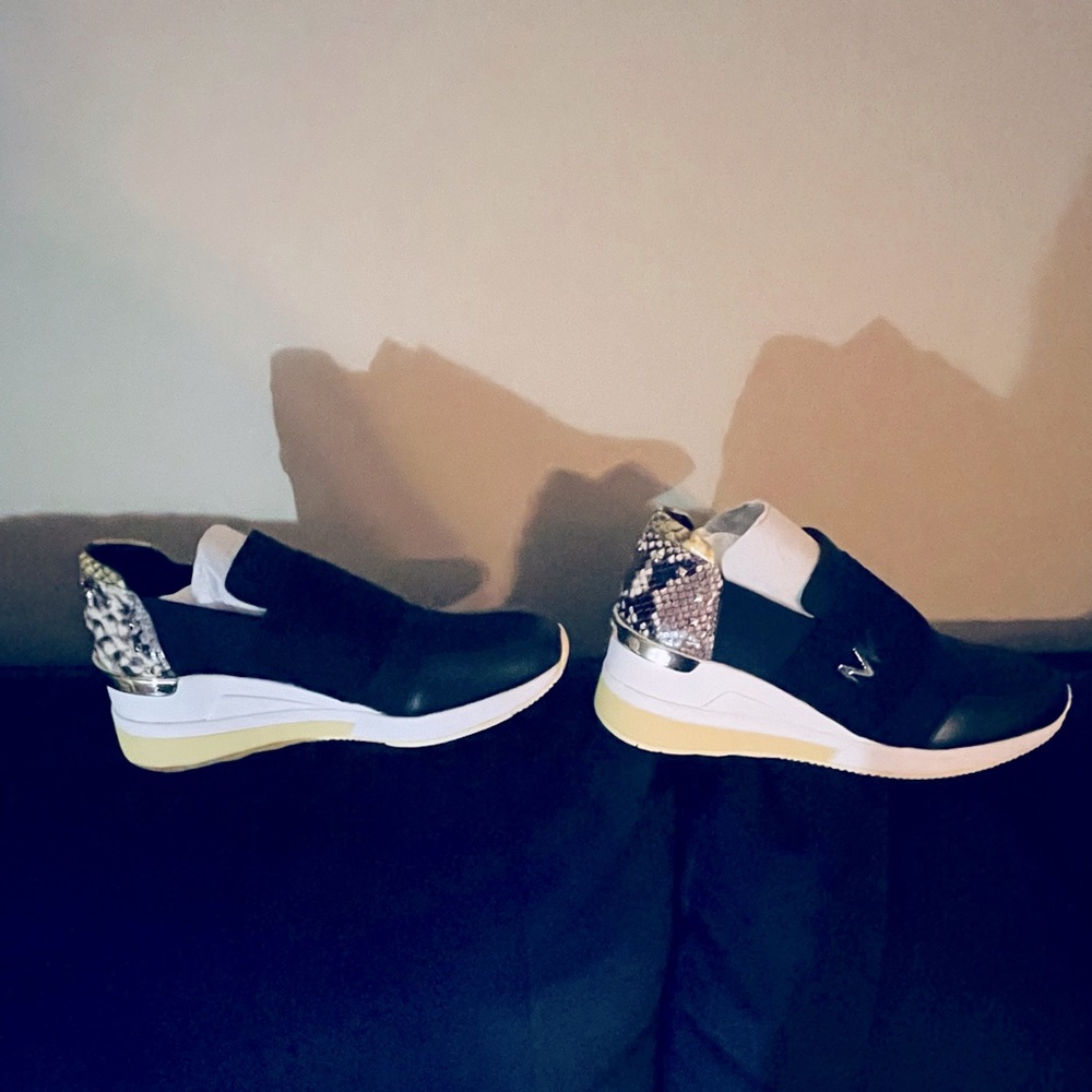 Slip on Michael Kors shoes size 10.